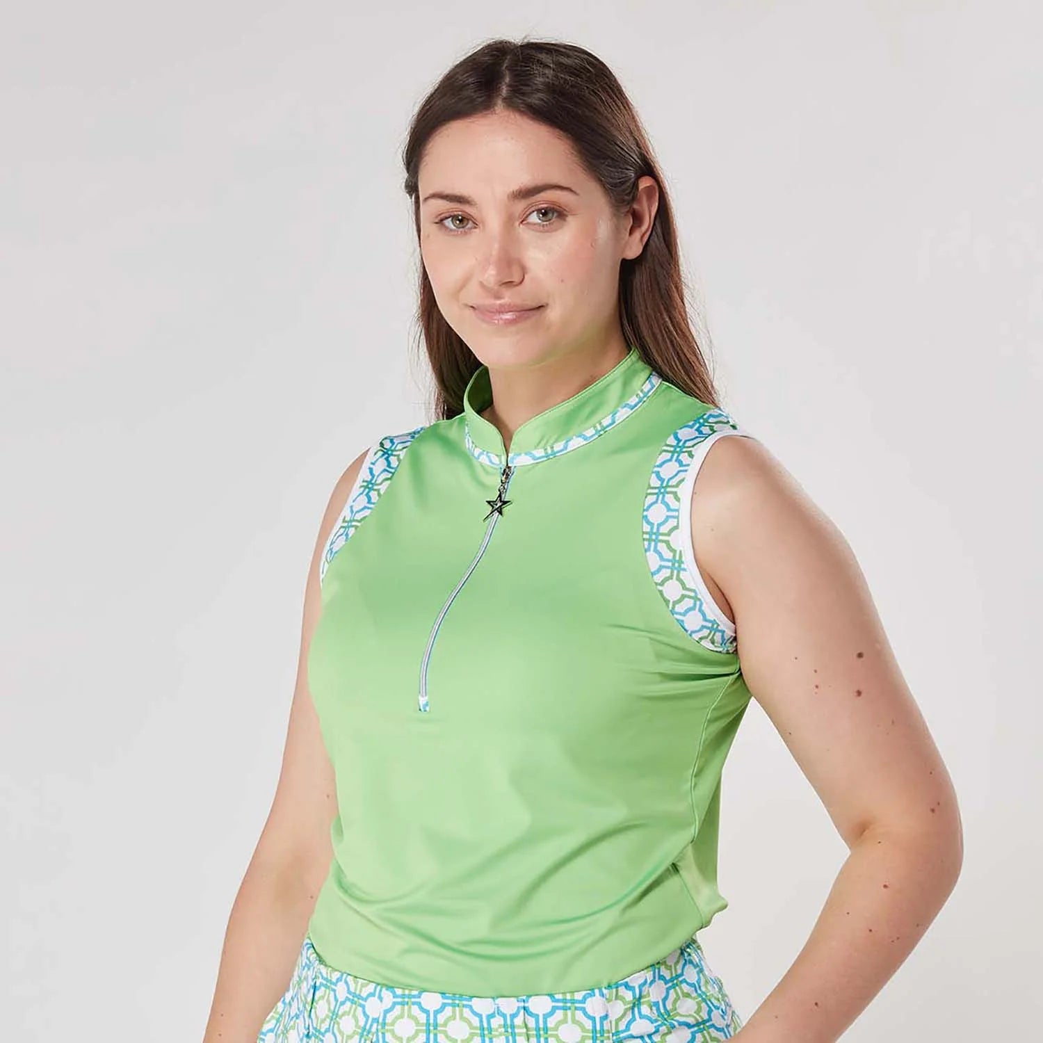 Swing Out Sister Ladies Alice Patterned Sleeveless Print Polo in Dazzling Blue and Emerald with Zip-Neck